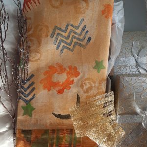 Gift box, decorative kitchen or bath hand towel stamp printed using traditional 'adinkra' African motifs, acrylic painted with gold glaze